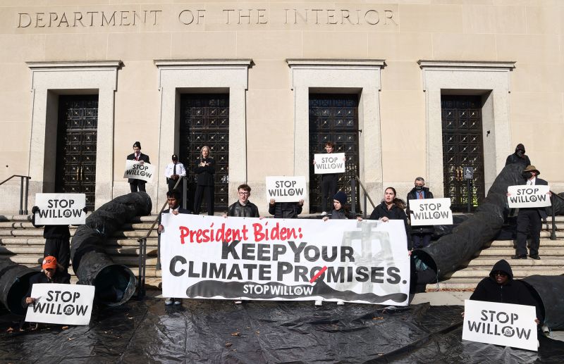 Climate activists hold a demonstration to urge President Biden to reject the Willow Project at the US Department of Interior on November 17, 2022, in Washington, DC.